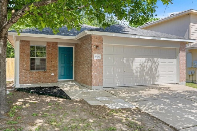 8608 Dittmar Oaks Dr, Austin, TX 78748 - ranch-style home featuring brick siding, a garage, concrete driveway, and roof with shingles