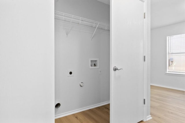 8608 Dittmar Oaks Dr, Austin, TX 78748 - washroom with electric dryer hookup, hookup for a washing machine, wood finished floors, baseboards, and hookup for a gas dryer