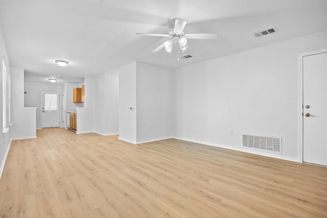8608 Dittmar Oaks Dr, Austin, TX 78748 - unfurnished living room with light wood-style flooring, ceiling fan, and baseboards
