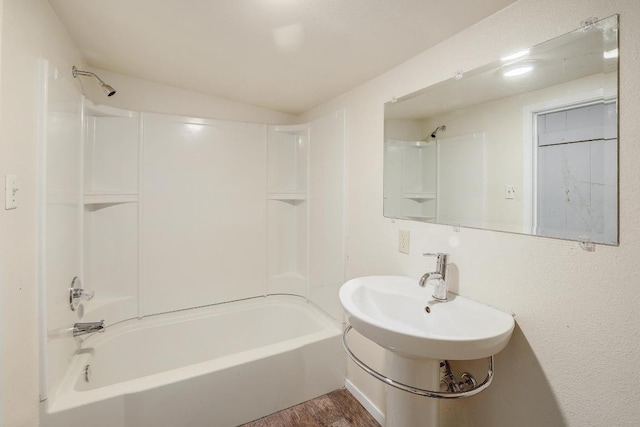 300 W Cleveland St, Elgin, TX 78621 - full bathroom with bathing tub / shower combination and wood finished floors