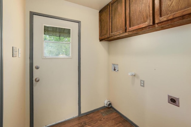 300 W Cleveland St, Elgin, TX 78621 - washroom with electric dryer hookup, washer hookup, cabinet space, dark wood-style flooring, and gas dryer hookup