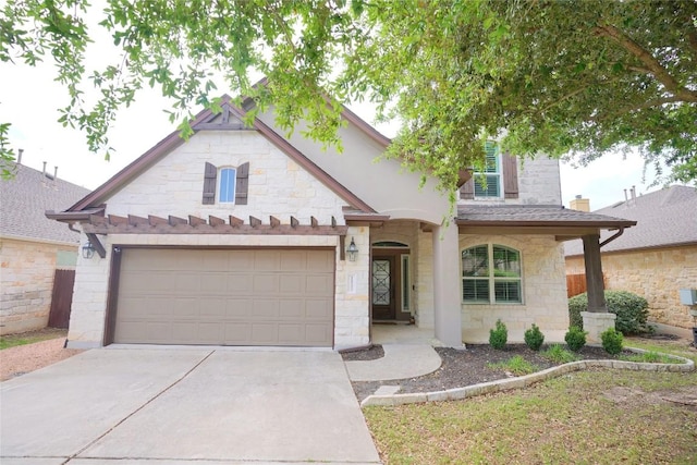 11721 Quintana Cv, Austin, TX 78739 - view of front of house featuring stone siding and driveway