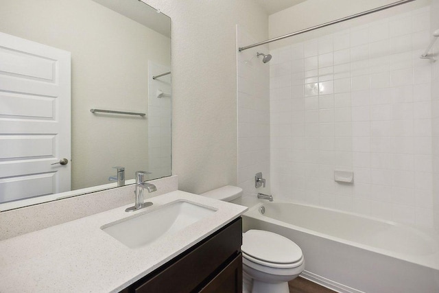 bathroom featuring shower / bath combination, vanity, and toilet