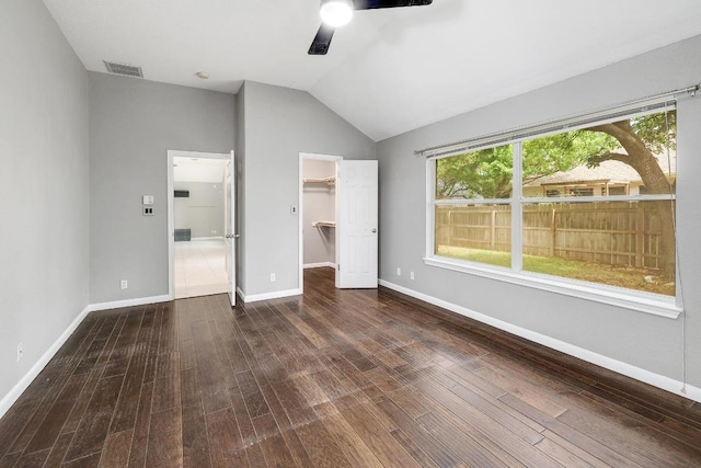 2616 Glenwood Trl, Cedar Park, TX 78613 - unfurnished bedroom featuring wood finished floors, lofted ceiling, a spacious closet, and baseboards