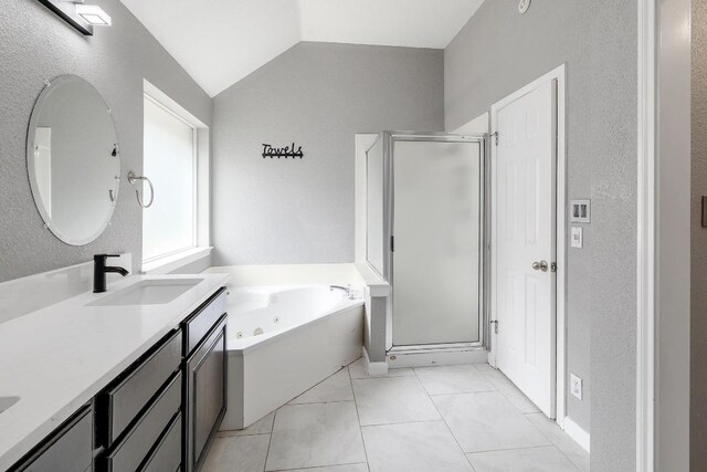 2616 Glenwood Trl, Cedar Park, TX 78613 - full bath featuring a shower stall, a tub with jets, double vanity, lofted ceiling, and a textured wall