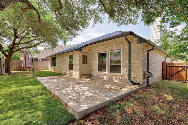 2616 Glenwood Trl, Cedar Park, TX 78613 - back of property with a chimney, a patio, and stone siding