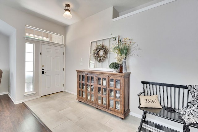 entryway featuring baseboards