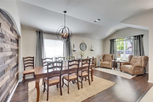 dining area featuring visible vents, baseboards, a chandelier, and dark wood-style floors
