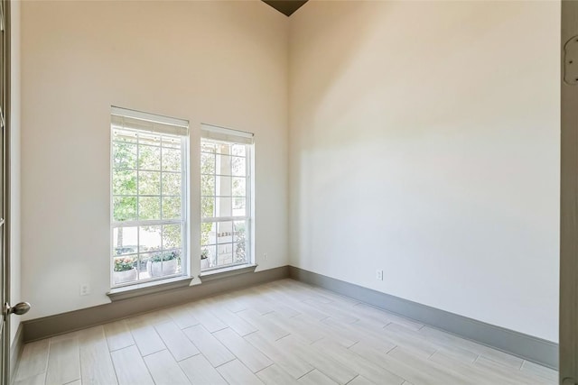 18705 Alonso Pl, Austin, TX 78738 - spare room featuring plenty of natural light and wood tiled floors