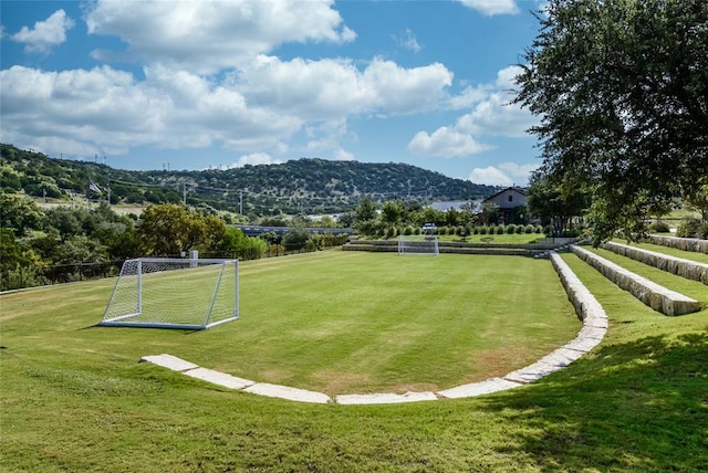 18705 Alonso Pl, Austin, TX 78738 - view of property's community with an area for soccer and a mountain view