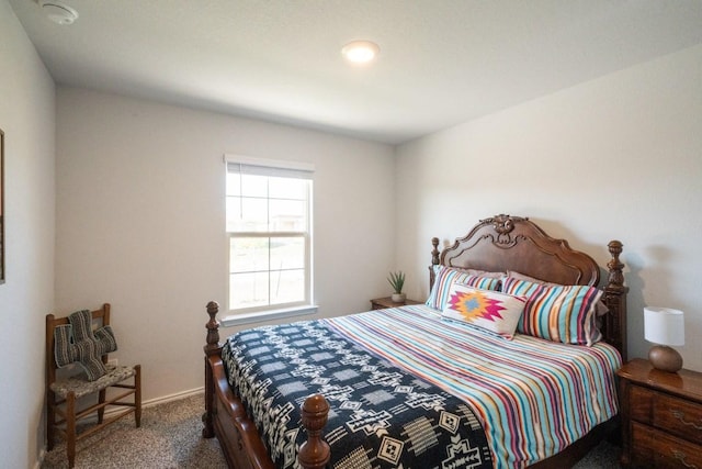 bedroom featuring carpet flooring and baseboards