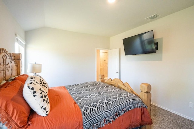 carpeted bedroom featuring baseboards, lofted ceiling, and visible vents