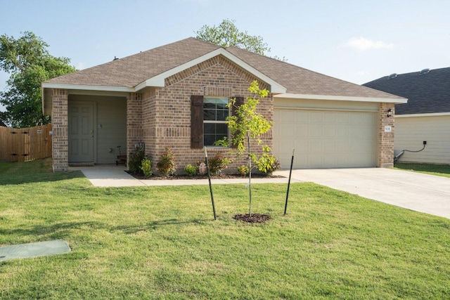 single story home with an attached garage, concrete driveway, brick siding, a front lawn, and roof with shingles