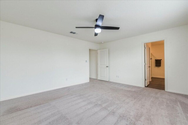 196 Thistle Ln, Maxwell, TX 78656 - unfurnished bedroom with carpet flooring, ensuite bath, and ceiling fan