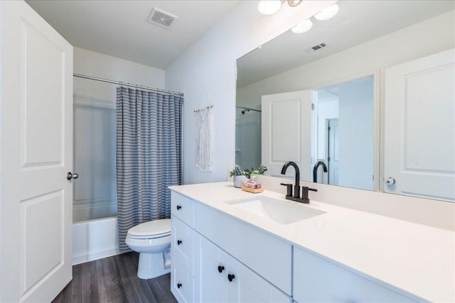196 Thistle Ln, Maxwell, TX 78656 - bathroom with vanity, wood finished floors, toilet, and shower / bath combination with curtain