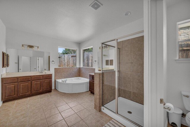 1107 Shiloh St, Cedar Park, TX 78613 - bathroom featuring a garden tub, a shower stall, vanity, toilet, and tile patterned flooring