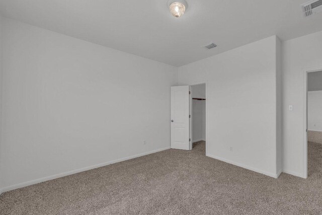 1107 Shiloh St, Cedar Park, TX 78613 - unfurnished bedroom with carpet, a spacious closet, baseboards, and a closet