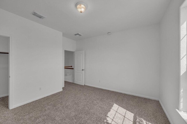 1107 Shiloh St, Cedar Park, TX 78613 - unfurnished bedroom with carpet flooring and a spacious closet