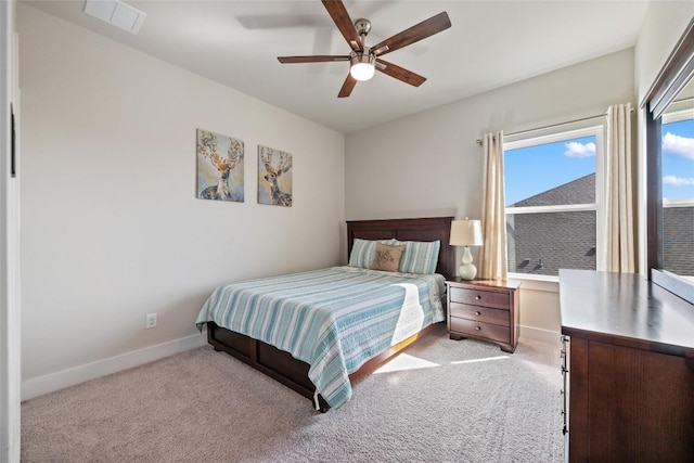 carpeted bedroom featuring baseboards and ceiling fan