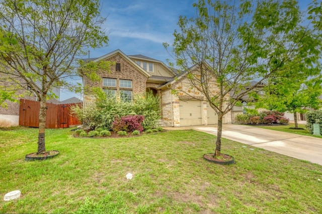 5917 Moriano Cv, Round Rock, TX 78665 - view of front of house featuring driveway, an attached garage, stone siding, and brick siding