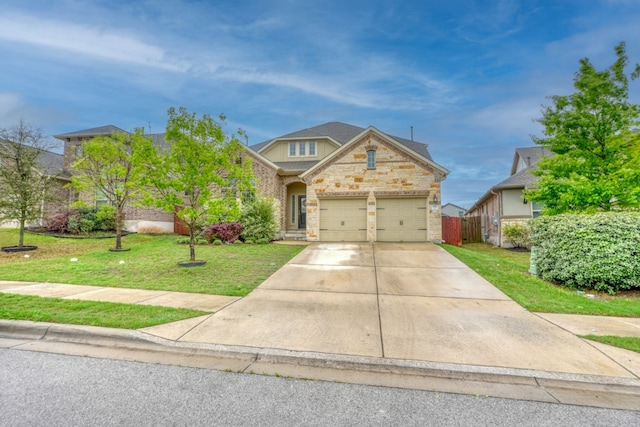5917 Moriano Cv, Round Rock, TX 78665 - traditional home featuring driveway, stone siding, and an attached garage