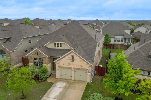 birds eye view of property with a residential view