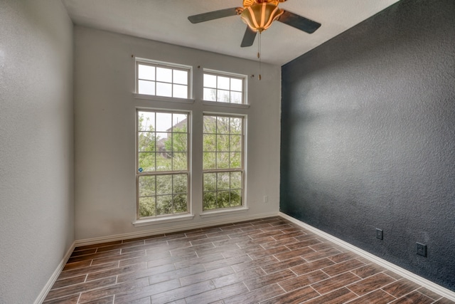 5917 Moriano Cv, Round Rock, TX 78665 - empty room featuring wood tiled floors, a textured wall, and ceiling fan