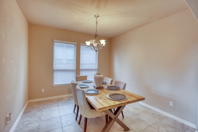 5917 Moriano Cv, Round Rock, TX 78665 - dining space with a chandelier and light tile patterned floors