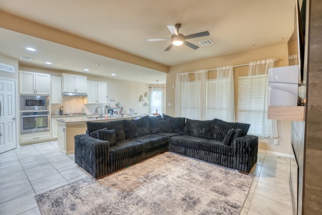5917 Moriano Cv, Round Rock, TX 78665 - living room with light tile patterned flooring, a ceiling fan, and recessed lighting