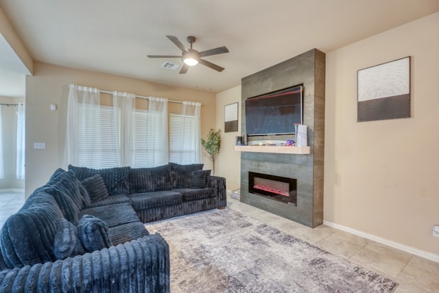 5917 Moriano Cv, Round Rock, TX 78665 - tiled living room featuring ceiling fan and a tiled fireplace