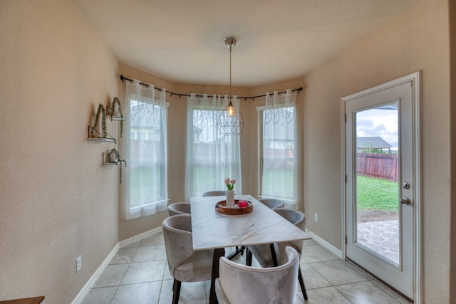 5917 Moriano Cv, Round Rock, TX 78665 - dining room featuring light tile patterned flooring and baseboards