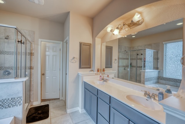 5917 Moriano Cv, Round Rock, TX 78665 - full bath featuring tile patterned floors, a stall shower, a garden tub, and double vanity