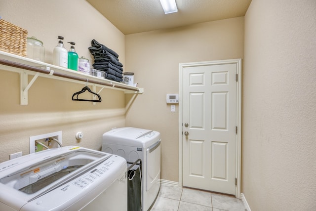 5917 Moriano Cv, Round Rock, TX 78665 - laundry area with washer and dryer and light tile patterned floors