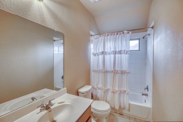 5917 Moriano Cv, Round Rock, TX 78665 - bathroom featuring toilet, shower / bath combo with shower curtain, vanity, a textured wall, and lofted ceiling