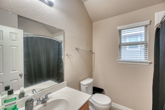 5917 Moriano Cv, Round Rock, TX 78665 - full bathroom with toilet, vanity, a textured wall, vaulted ceiling, and a shower with curtain
