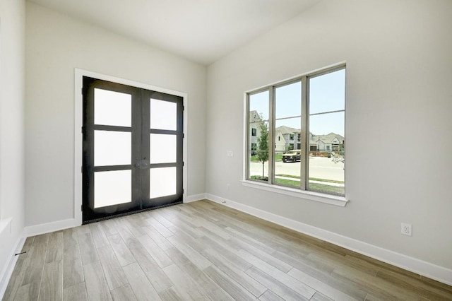 300 Echo Pass, Liberty Hill, TX 78642 - unfurnished room with french doors and wood finished floors