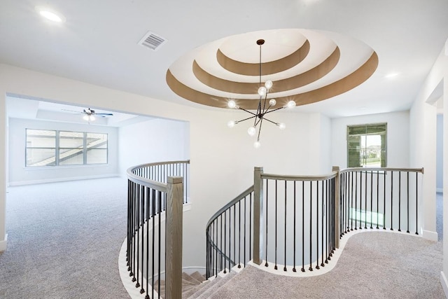 300 Echo Pass, Liberty Hill, TX 78642 - stairs featuring carpet, a chandelier, and a tray ceiling