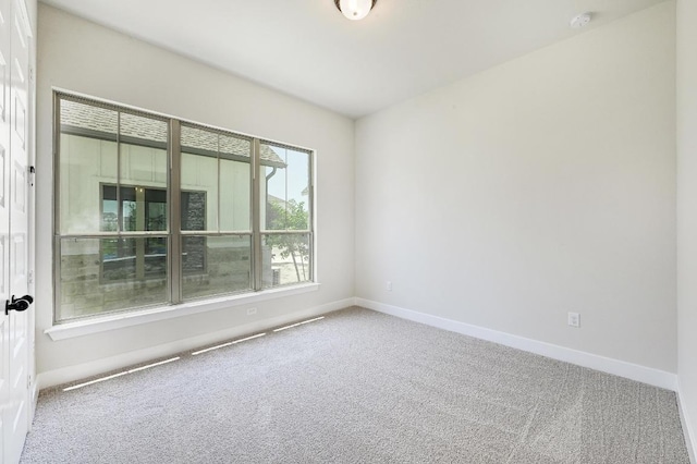 300 Echo Pass, Liberty Hill, TX 78642 - empty room featuring carpet floors and a smoke detector