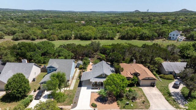 drone / aerial view with a residential view and a forest view