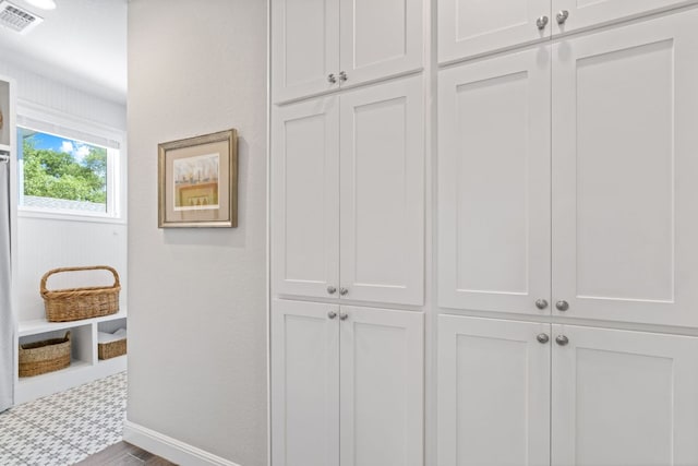 room details featuring baseboards and visible vents