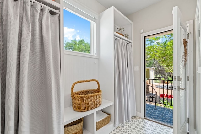 doorway featuring light floors