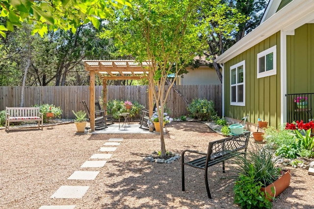view of yard featuring a fenced backyard, a patio, and a pergola