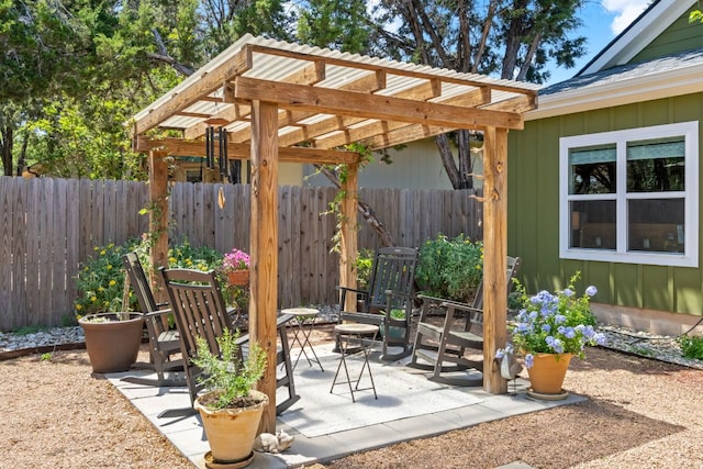 view of patio / terrace with fence and a pergola