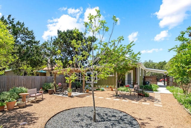 exterior space featuring a fenced backyard and a gate