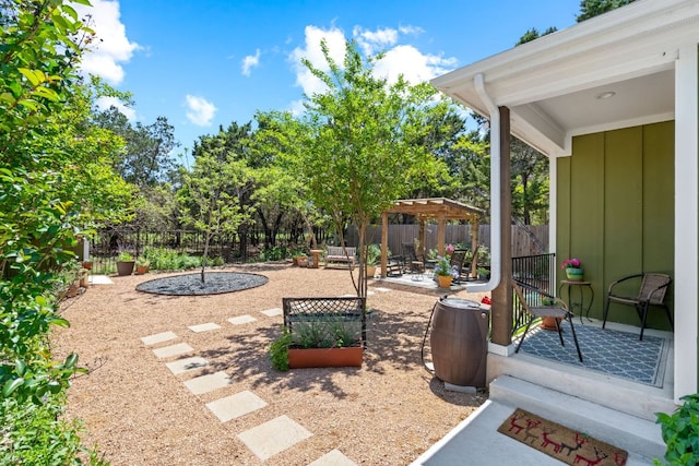 view of yard with a patio, a fenced backyard, and a pergola