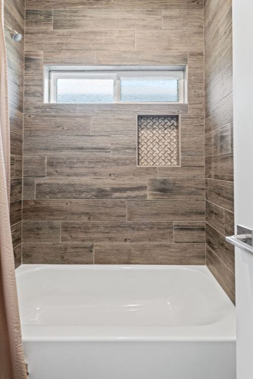 full bath with a bath