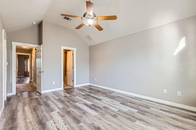 2632 Century Park Blvd Unit 3, Austin, TX 78727 - unfurnished bedroom with wood finished floors, baseboards, vaulted ceiling, and visible vents