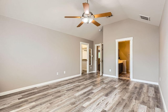 2632 Century Park Blvd Unit 3, Austin, TX 78727 - unfurnished bedroom featuring visible vents, ensuite bathroom, a spacious closet, wood finished floors, and lofted ceiling