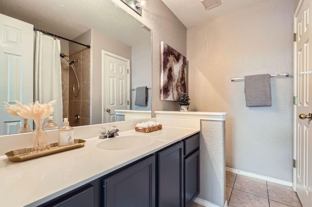 2632 Century Park Blvd Unit 3, Austin, TX 78727 - bathroom featuring visible vents, baseboards, curtained shower, vanity, and tile patterned flooring