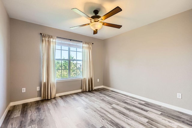 2632 Century Park Blvd Unit 3, Austin, TX 78727 - spare room with wood finished floors, baseboards, and a ceiling fan
